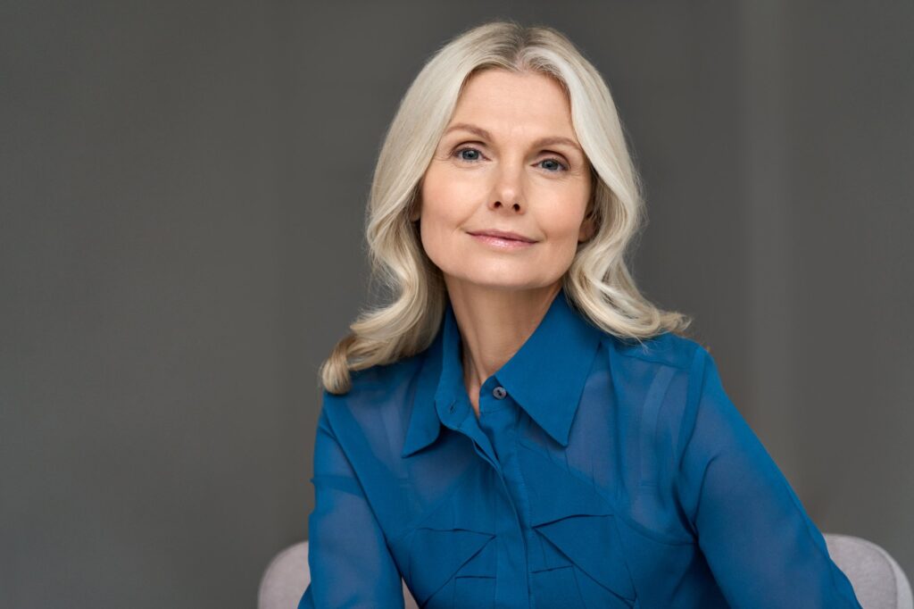 Mature woman smiling with a defined jawline Mature woman smiling with a defined jawline