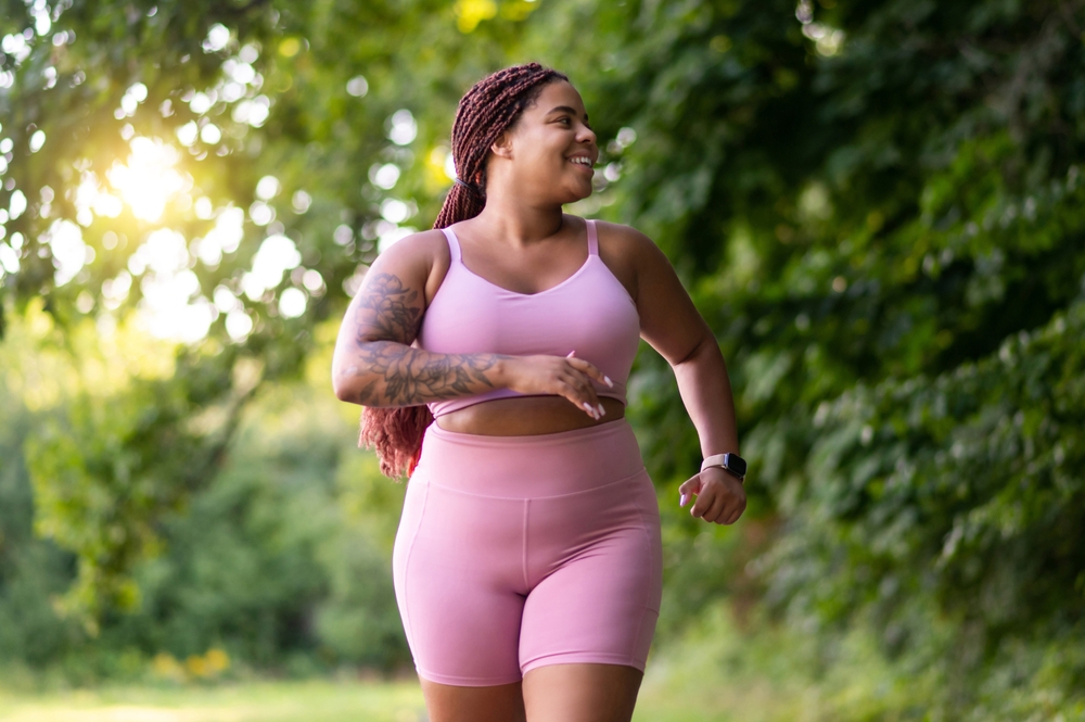 Healthy plus-sized woman on a walk outside, feeling confident with her results from Plus Size Tummy Tuck® surgery in Scottsdale. Healthy plus-sized woman on a walk outside, feeling confident with her results from Plus Size Tummy Tuck® surgery in Scottsdale.